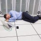 Man sleeping in data center on the floor