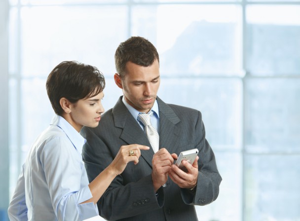 Businesspeople using mobile
