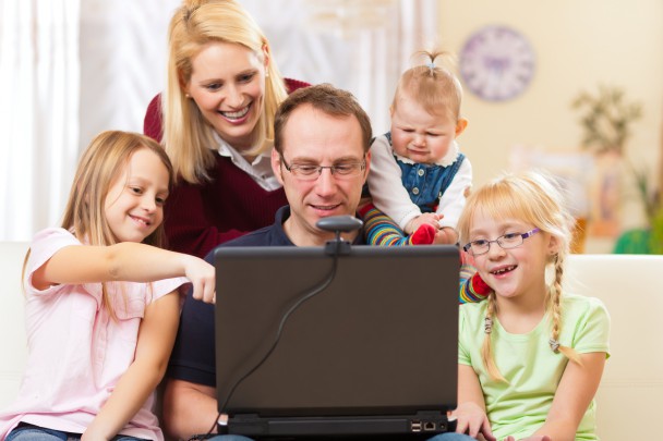 Family with computer having video conference