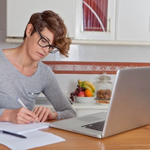 woman working or blogging in home office.