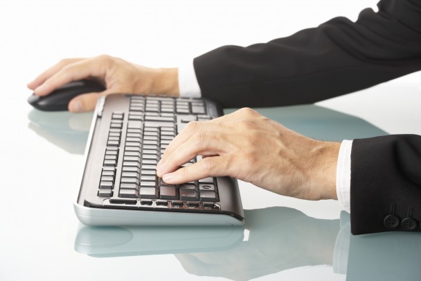 male manager using wireless keyboard and mouse