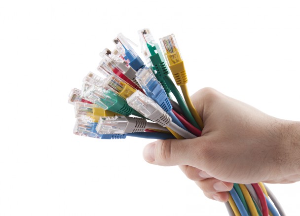 stockfresh_3079442_hand-holding-colorful-internet-cables_sizeM