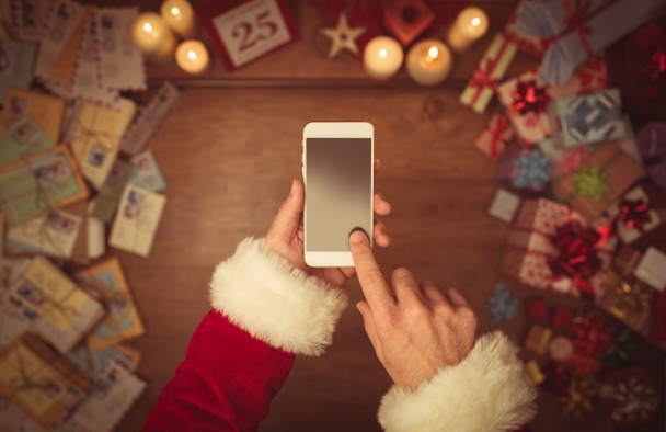 Santa Claus using a smart phone