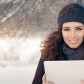 stockfresh_6454048_winter-woman-with-tablet-outside-in-the-snow_sizeM