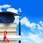 Stack of books with diploma against blue sky