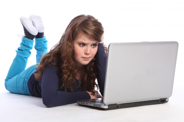 Confused teenager girl in danger on internet