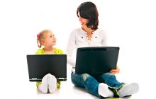ma and child with laptop on white background